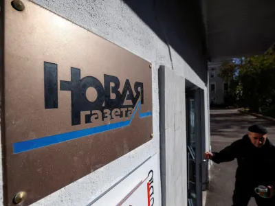 FILE PHOTO: Russian investigative newspaper Novaya Gazeta's plate is seen next to an entrance to the office in Moscow October 8, 2021. REUTERS/Maxim Shemetov/File Photo