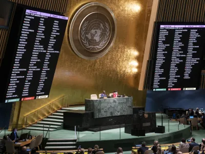 Voting commences on a resolution during a meeting of the United Nations General Assembly, Thursday, April 7, 2022, at United Nations headquarters. UN General Assembly approved a resolution suspending Russia from the world body's leading human rights organization. (AP Photo/John Minchillo)