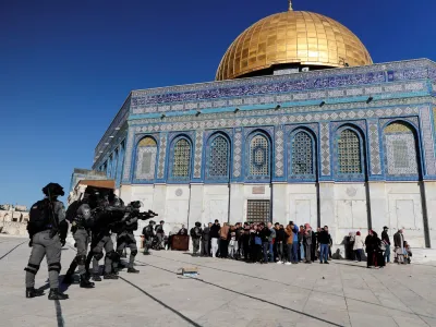 Israeli security forces move in positions during clashes with Palestinian protestors at the compound that houses Al-Aqsa Mosque, known to Muslims as Noble Sanctuary and to Jews as Temple Mount, in Jerusalem's Old City April 15, 2022. REUTERS/Ammar Awad
