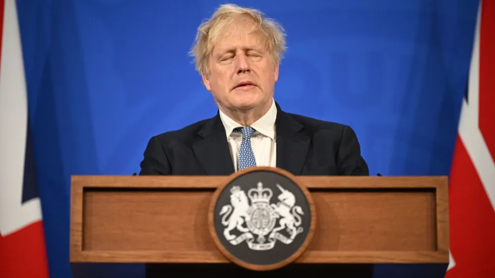 Britain's Prime Minister Boris Johnson speaks during a press conference in Downing Street, London, Wednesday, May 25 2022, following the publication of Sue Gray's report into Downing Street parties in Whitehall. An investigative report blames British Prime Minister Boris Johnson and other senior leaders for allowing boozy government parties that broke the U.K.'s COVID-19 lockdown rules. While Johnson said he took "full responsibility" for the breach, he insisted he would not resign. (Leon Neal/Pool Photo via AP)