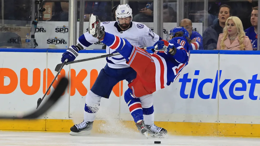 Jun 1, 2022; New York, New York, USA; Tampa Bay Lightning left wing Alex Killorn (17) hits New York Rangers left wing Artemi Panarin (10) in the third period of game one of the Eastern Conference Final of the 2022 Stanley Cup Playoffs at Madison Square Garden. Mandatory Credit: Danny Wild-USA TODAY Sports