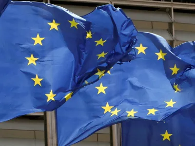 FILE PHOTO: European Union flags flutter outside the EU Commission headquarters in Brussels, Belgium May 5, 2021. REUTERS/Yves Herman/File Photo
