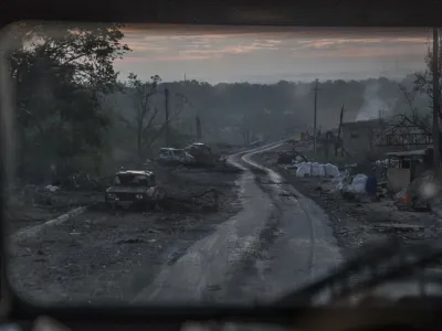 The gutted remains of cars lie along a road during heavy fighting at the front line in Severodonetsk, Luhansk region, Ukraine, Wednesday, June 8, 2022. (AP Photo/Oleksandr Ratushniak)
