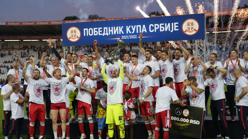 Red Star players celebrate after winning Serbia's national Cup final soccer match between Red Star and Partizan in Belgrade, Serbia, Sunday, May 26, 2022. (AP Photo/Darko Vojinovic)