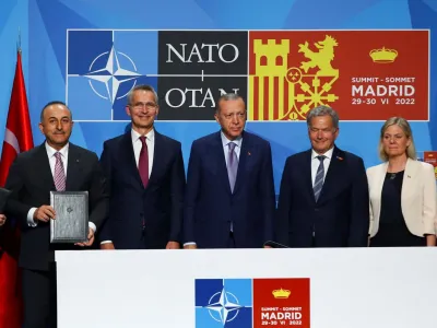 Turkish President Tayyip Erdogan, Finland's President Sauli Niinisto, Sweden's Prime Minister Magdalena Andersson and NATO Secretary General Jens Stoltenberg deliver a statement during a NATO summit in Madrid, Spain June 28, 2022. REUTERS/Violeta Santos Moura