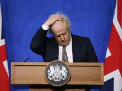 FILE - Britain's Prime Minister Boris Johnson gestures as he speaks during a press conference in London, Saturday Nov. 27, 2021, after cases of the new COVID-19 variant were confirmed in the UK. Johnson was dealt a major blow Tuesday, July 5, 2022, when two of his most senior Cabinet ministers quit, saying they had lost confidence in Johnson's leadership. (Hollie Adams/Pool via AP, File)