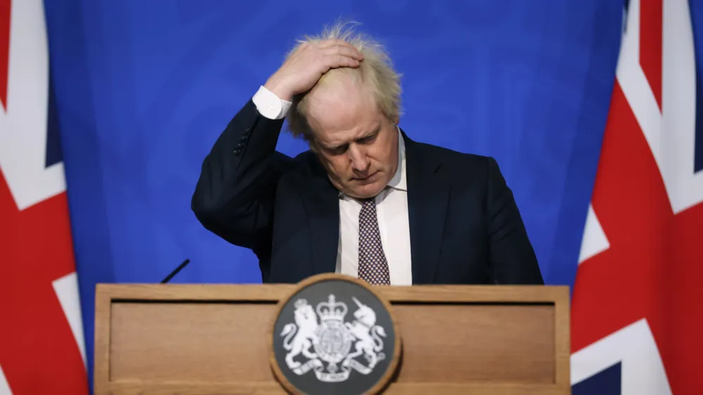 FILE - Britain's Prime Minister Boris Johnson gestures as he speaks during a press conference in London, Saturday Nov. 27, 2021, after cases of the new COVID-19 variant were confirmed in the UK. Johnson was dealt a major blow Tuesday, July 5, 2022, when two of his most senior Cabinet ministers quit, saying they had lost confidence in Johnson's leadership. (Hollie Adams/Pool via AP, File)