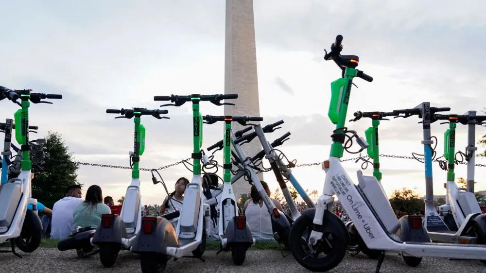 Electric scooters are parked during the annual Independence Day fireworks celebration on the National Mall in Washington, U.S July 4, 2022. REUTERS/Joshua Roberts