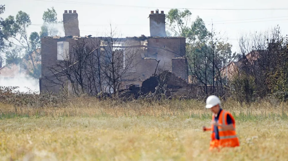 20 July 2022, United Kingdom, Wennington: The scene after a blaze in the village of Wennington, east London after temperatures topped 40C in the UK for the first time ever, as the sweltering heat fuelled fires and widespread transport disruption. Photo: Kirsty O'connor/PA Wire/dpa