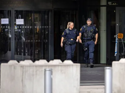 Police officers walk out of the Emporia Shopping Center, following a shooting, in Malmo, Sweeden August 20, 2022. TT News Agency/Johan Nilsson via REUTERS ATTENTION EDITORS - THIS IMAGE WAS PROVIDED BY A THIRD PARTY. SWEDEN OUT. NO COMMERCIAL OR EDITORIAL SALES IN SWEDEN.