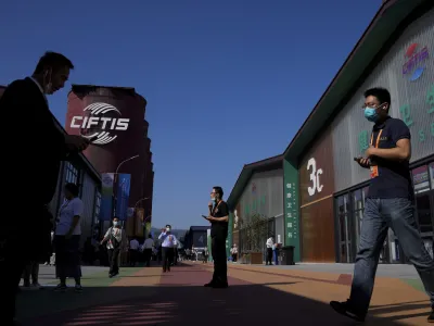 Visitors tour the China International Fair for Trade in Services (CIFTIS) at the Shougang venue in Beijing, Thursday, Sept. 1, 2022. (AP Photo/Andy Wong)