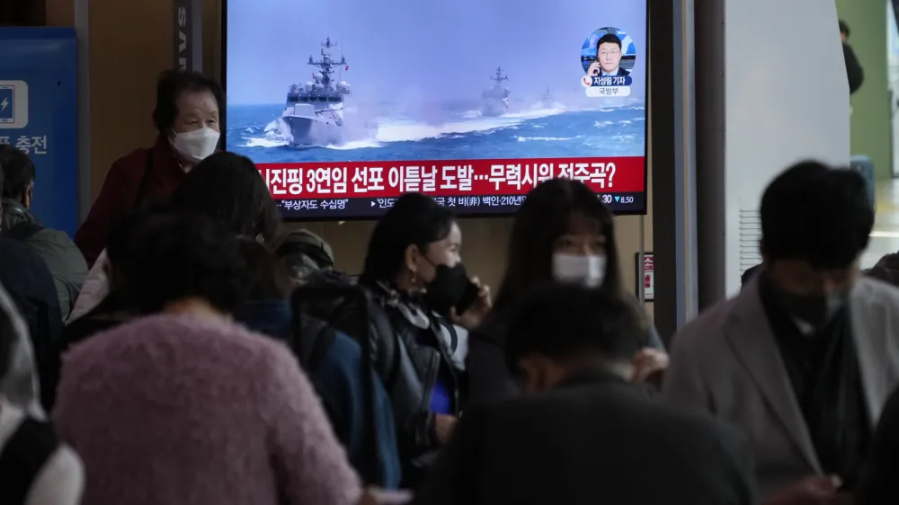 A TV screen shows a file image of South Korean navy vessels during a news program at the Seoul Railway Station in Seoul, South Korea, Monday, Oct. 24, 2022. The rival Koreas exchanged warning shots along their disputed western sea boundary on Monday, their militaries said, amid heightened animosities over North Korea's recent barrage of weapons tests. (AP Photo/Ahn Young-joon)