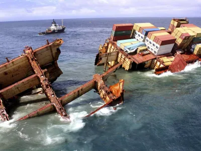Debris floats around the remains of the stricken container ship Rena as it submerges, about 14 nautical miles (22 km) from Tauranga, on the east coast of New Zealand's North Island January 10, 2012. The stern section of the stricken cargo ship is slipping off a New Zealand reef where it has been stuck for three months and is in danger of sinking, authorities said, complicating salvage efforts in one of the nation's worst environmental disasters. REUTERS/Maritime New Zealand/Handout (NEW ZEALAND - Tags: DISASTER ENVIRONMENT) FOR EDITORIAL USE ONLY. NOT FOR SALE FOR MARKETING OR ADVERTISING CAMPAIGNS. THIS IMAGE HAS BEEN SUPPLIED BY A THIRD PARTY. IT IS DISTRIBUTED, EXACTLY AS RECEIVED BY REUTERS, AS A SERVICE TO CLIENTS