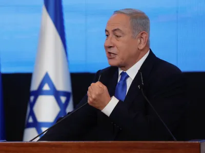 Likud party leader Benjamin Netanyahu gestures as he addresses his supporters at his party headquarters during Israel's general election in Jerusalem, November 2, 2022. REUTERS/Ammar Awad