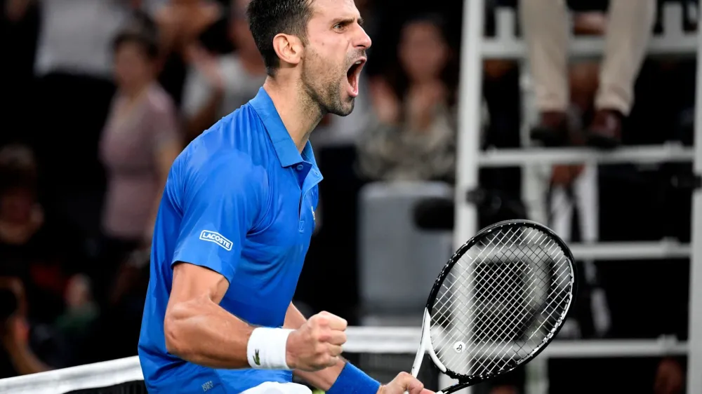 05 November 2022, France, Paris: Serbian tennis player Novak Djokovic celebrates defeating Greek Stefanos Tsitsipas at their men's singles semi-final tennis match on day 6 of the ATP World Tour Masters 1000 at The AccorHotels Arena. Photo: Julien De Rosa/AFP/dpa