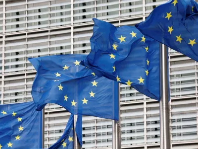 FILE PHOTO: European Union flags flutter outside the EU Commission headquarters in Brussels, Belgium, September 28, 2022. REUTERS/Yves Herman/File Photo