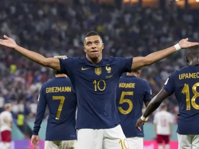 France's Kylian Mbappe celebrates scoring his side's opening goal against Denmark during a World Cup group D soccer match at the Stadium 974 in Doha, Qatar, Saturday, Nov. 26, 2022. (AP Photo/Martin Meissner)