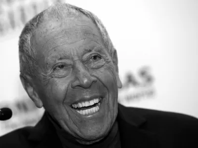 FILE PHOTO: Tennis coach Nick Bollettieri laughs during a news conference where he was introduced as one of the five new inductees to the International Tennis Hall of Fame in New York, March 3, 2014. REUTERS/Mike Segar/File Photo