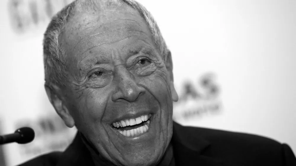 FILE PHOTO: Tennis coach Nick Bollettieri laughs during a news conference where he was introduced as one of the five new inductees to the International Tennis Hall of Fame in New York, March 3, 2014. REUTERS/Mike Segar/File Photo