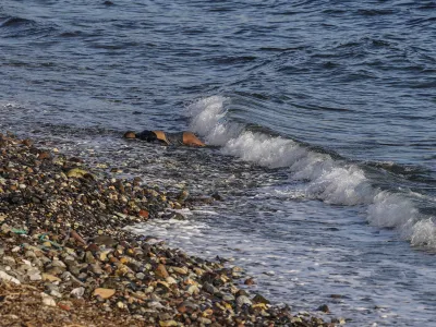 EDS NOTE: GRAPHIC CONTENT - The body of an unidentified man is seen washed up on a beach on the Greek island of Lesbos. on Tuesday, March 1, 2022. Greece&acirc;&euro;&trade;s coast guard says six bodies have been recovered from the shore of the eastern island of Lesbos, and authorities suspect the people were migrants who died in their attempt to make it to Greece from the nearby Turkish coast. (AP Photo/Panagiotis Balaskas)