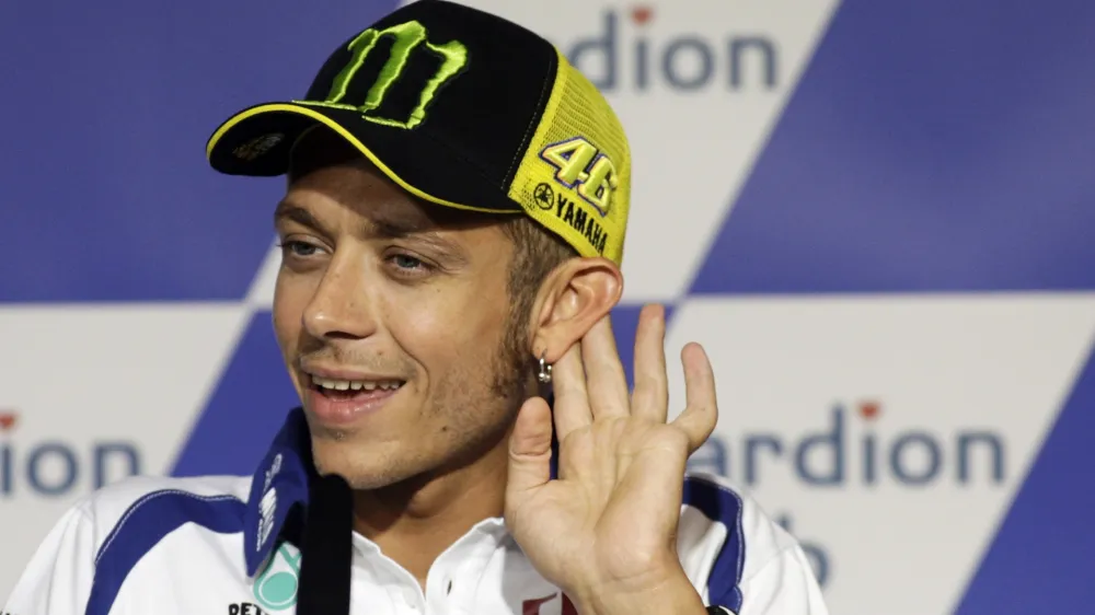 Yamaha MotoGP rider Valentino Rossi of Italy gestures during a news conference before the Czech Grand Prix in Brno August 12, 2010.  REUTERS/David W Cerny (CZECH REPUBLIC - Tags: SPORT MOTOR RACING)