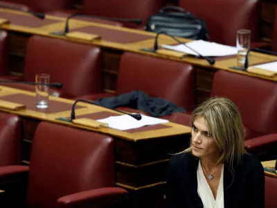 FILE PHOTO: Lawmaker Eva Kaili is seen in the parliament in Athens November 4, 2011, prior to a confidence vote. Kaili had announced she would stay in the party but refused to support the government in the confidence vote expected late on Friday, meaning Prime Minister George Papandreou could count at most on the support of 151 deputies. REUTERS/Yiorgos Karahalis (GREECE - Tags: POLITICS BUSINESS)/File Photo
