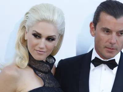 Musicians Gwen Stefani, left, and her husband Gavin Rossdale arrive for the amfAR Cinema Against AIDS benefit at the Hotel du Cap-Eden-Roc, during the 64th Cannes international film festival, in Cap d'Antibes, southern France, Thursday, May 19, 2011. (AP Photo/Francois Mori)