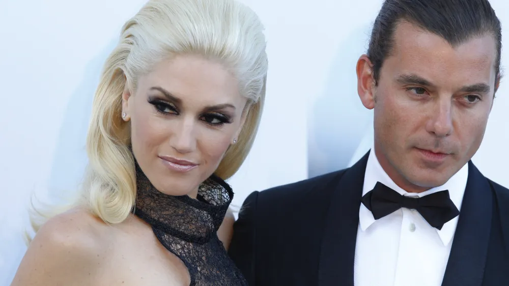 Musicians Gwen Stefani, left, and her husband Gavin Rossdale arrive for the amfAR Cinema Against AIDS benefit at the Hotel du Cap-Eden-Roc, during the 64th Cannes international film festival, in Cap d'Antibes, southern France, Thursday, May 19, 2011. (AP Photo/Francois Mori)