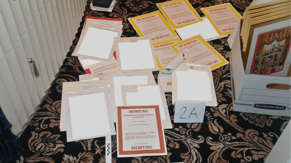 FILE - This image contained in a court filing by the Department of Justice on Aug. 30, 2022, and redacted by in part by the FBI, shows a photo of documents seized during the Aug. 8 search by the FBI of former President Donald Trump's Mar-a-Lago estate in Florida. For years, problems with classified materials have been a shortcut to controversy in Washington. (Department of Justice via AP)