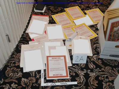FILE - This image contained in a court filing by the Department of Justice on Aug. 30, 2022, and redacted by in part by the FBI, shows a photo of documents seized during the Aug. 8 search by the FBI of former President Donald Trump's Mar-a-Lago estate in Florida. For years, problems with classified materials have been a shortcut to controversy in Washington. (Department of Justice via AP)