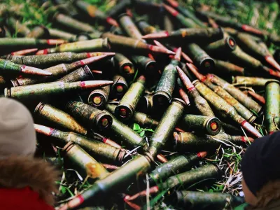 Children look at a picture taken in April 2022, as former British Prime Minister Boris Johnson visits the Church of Sviatoho Apostola Andriia Pervozvannoho (St. Apostle Andrew the First-Called) in Bucha, Kyivs'ka oblast, amid Russia's invasion of Ukraine, in Bucha, Ukraine January 22, 2023. REUTERS/Nacho Doce NO RESALES. NO ARCHIVES