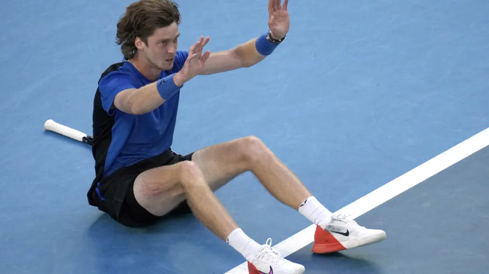 Andrey Rublev of Russia celebrates after defeating Holger Rune of Denmark in their fourth round match at the Australian Open tennis championship in Melbourne, Australia, Monday, Jan. 23, 2023. (AP Photo/Dita Alangkara)