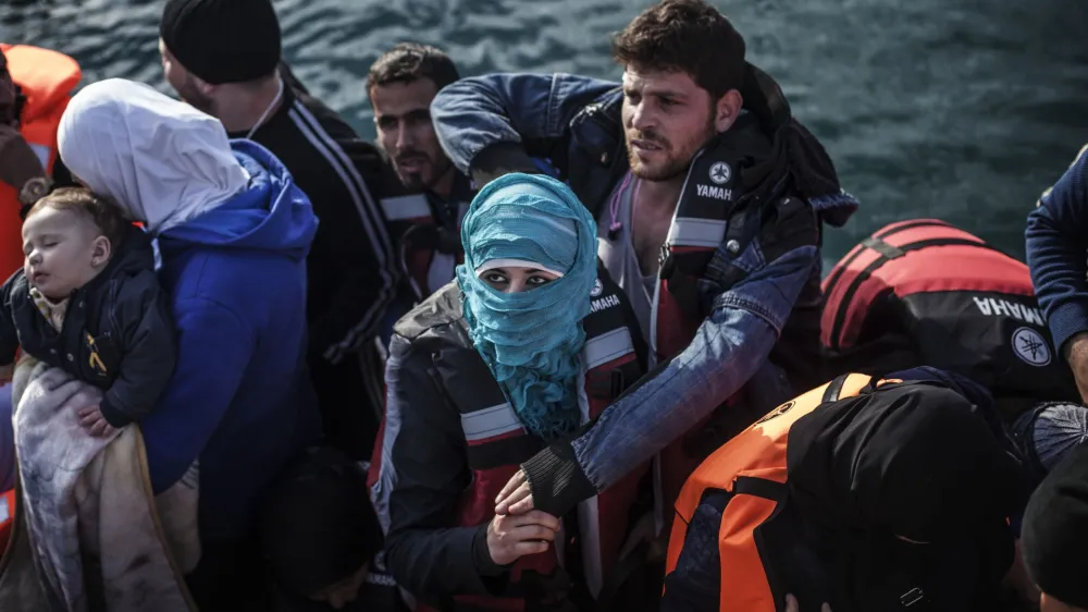 A vessel of the European border agency, Frontex, arrives carrying refugees and migrants after a rescue operation near the northeastern Greek island of Lesbos, in Mytilene, Greece, Tuesday, Feb. 23, 2016. Nearly 100,000 migrants and refugees have traveled to Greek islands from nearby Turkey so far this year. (AP Photo/Manu Brabo)