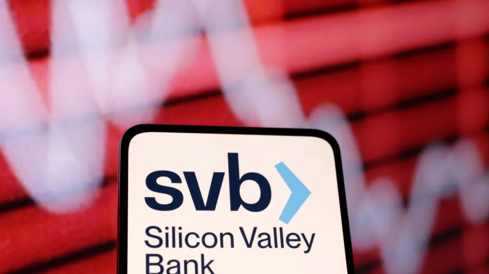 SVB (Silicon Valley Bank) logo and decreasing stock graph are seen in this illustration taken March 10, 2023. REUTERS/Dado Ruvic/Illustration