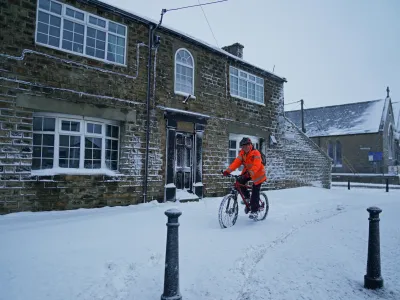 10 March 2023, United Kingdom, Tow Law: A cyclist makes their way through a snow-covered road in Tow Law, Co Durham, after a heavy overnight snowfall. Photo: Owen Humphreys/PA Wire/dpa