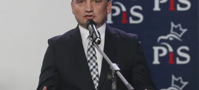 FILE - The current Poland's justice minister Zbigniew Ziobro, speaks to reporters alongside in Warsaw, Poland, Saturday, Sept. 26, 2020. Poland's divisive justice minister, Zbigniew Ziobro, has drawn surprised comments after a gust of wind revealed that he carries a gun tucked in his belt. (AP Photo/Czarek Sokolowski, File)