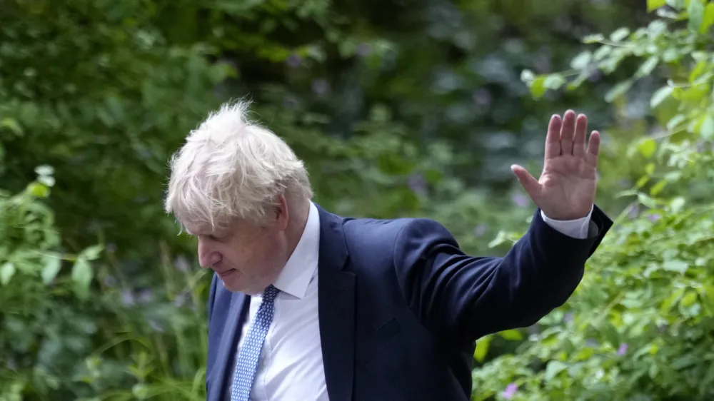 Britain's Prime Minister Boris Johnson waves as he walks down Downing Street after a press conference in London, Wednesday, May 25, 2022.A report into lockdown-breaching U.K. government parties says blame for a "culture" of rule-breaking in Prime Minister Boris Johnson's office must rest with those at the top. Senior civil servant Sue Gray's long-awaited report was published Wednesday.(AP Photo/Kirsty Wigglesworth)