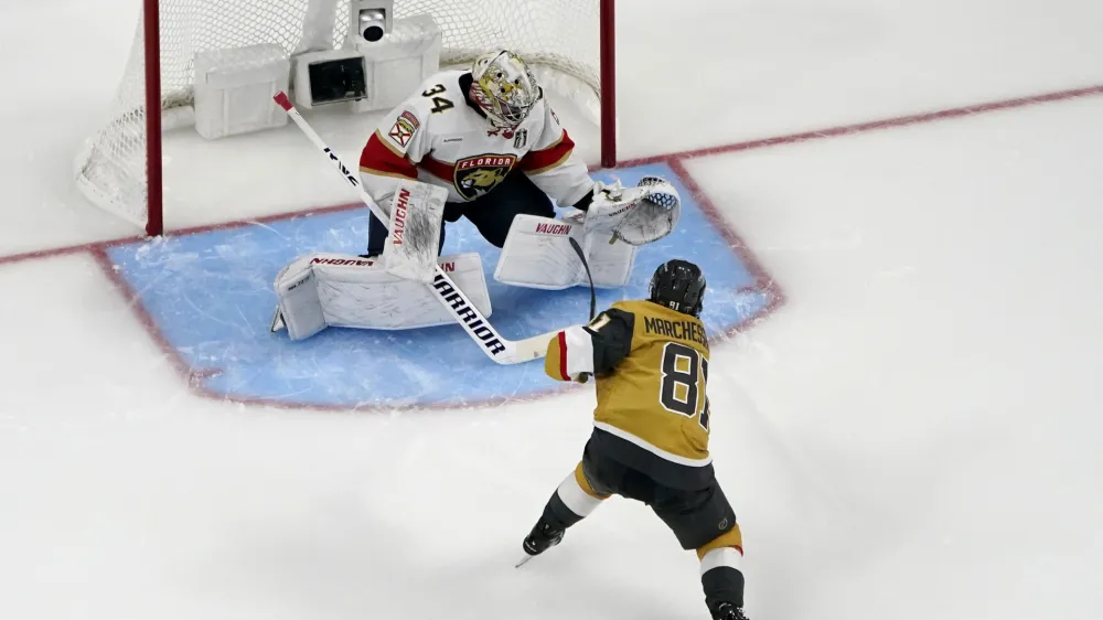 Vegas Golden Knights right wing Jonathan Marchessault (81) scores a goal on Florida Panthers goaltender Alex Lyon (34) during the third period of Game 2 of the NHL hockey Stanley Cup Finals, Monday, June 5, 2023, in Las Vegas. The Golden Knights defeated the Panthers 7-2 to take a 2-0 series lead. (AP Photo/John Locher)