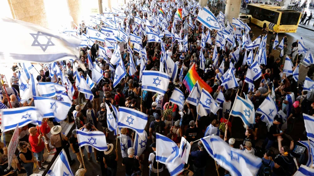 People demonstrate as a response to Israeli Prime Minister Benjamin Netanyahu and his nationalist coalition government's judicial overhaul, at Ben Gurion International Airport in Lod, Israel July 11, 2023. REUTERS/Amir Cohen