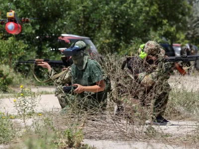 Members of a Russian territorial defence female unit operate FPV drones and practise battle tactics while training at a firing ground near Yevpatoriya, Crimea, July 22, 2023. REUTERS/Alexey Pavlishak