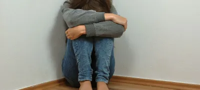 Lonely girl crying in the corner<br>depressed
