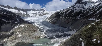 FILE - A lake of meltwater has formed on the tongue of the Rhone Glacier near Goms, Switzerland, on June 13, 2023. A Swiss Academy of Sciences panel is reporting a dramatic acceleration of glacier melt in the Alpine country, which has lost 10% of its ice volume in just two years after high summer heat and low snow volumes in winter. (AP Photo/Matthias Schrader, File)
