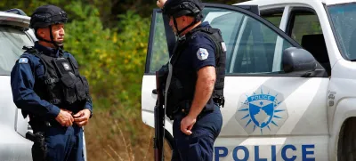 Police officers stand guard in the aftermath of a shooting, near the village of Zvecane, Kosovo September 24, 2023. REUTERS/Ognen Teofilovski