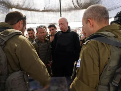HANDOUT - 19 October 2023, Israel, ---: Israeli Minister of Defense Yoav Gallant with soldiers deployed to the border and conducted a situation assessment in the IDF's Southern Command. Photo: Ariel Hermoni/GPO/dpa - ATTENTION: editorial use only and only if the credit mentioned above is referenced in full