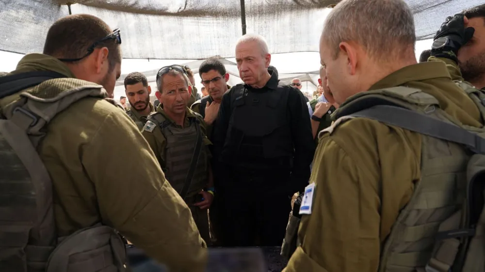 HANDOUT - 19 October 2023, Israel, ---: Israeli Minister of Defense Yoav Gallant with soldiers deployed to the border and conducted a situation assessment in the IDF's Southern Command. Photo: Ariel Hermoni/GPO/dpa - ATTENTION: editorial use only and only if the credit mentioned above is referenced in full