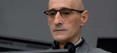 Salih Mustafa, a former Kosovo rebel, waits in the Kosovo Specialist Chambers court for the judges to read the verdict in The Hague, Netherlands, December 16, 2022. Mustafa is charged with the war crimes of arbitrary detention, cruel treatment, the torture of at least six people and the murder of one person at a detention compound in Zllash, Kosovo, in April 1999. Salih Mustafa pleaded not guilty to all charges. Peter Dejong/Pool via REUTERS