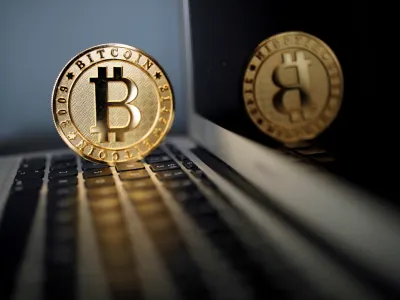 FILE PHOTO: A bitcoin is seen in an illustration picture taken at La Maison du Bitcoin in Paris, France, June 23, 2017. REUTERS/Benoit Tessier/File Photo