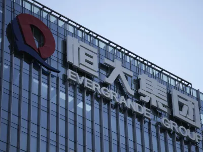 FILE - The Evergrande Group headquarters logo is seen in Shenzhen in southern China's Guangdong province on Sept. 24, 2021. A top executive of China Evergrande's electric vehicle company has been detained by police in the latest sign of trouble for the world's most heavily indebted property developer. (AP Photo/Ng Han Guan, File)