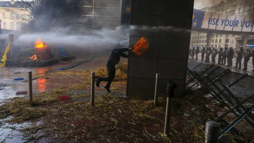 BRUSSELS, BELGIUM - FEBRUARY 01: Police spray waters to protesters near the entrance of the European Parliament building during the farmer protest action as they demand to have better conditions to grow, produce and maintain a proper income, on the day of a special European Council meeting in Brussels, Belgium on February 1, 2024. Nicola Landemard / AnadoluNo Use USA No use UK No use Canada No use France No use Japan No use Italy No use Australia No use Spain No use Belgium No use Korea No use South Africa No use Hong Kong No use New Zealand No use Turkey