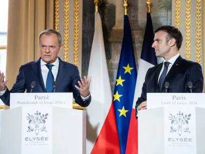 French President Emmanuel Macron and Polish Prime Minister Donald Tusk deliver a statement to the media as part of their meeting at Elysee Palace, Paris, France, 12 February 2024. Christophe Petit Tesson/Pool via REUTERS